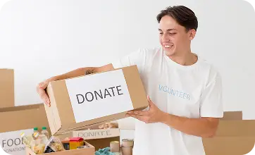 Volunteer Holding Donate Box