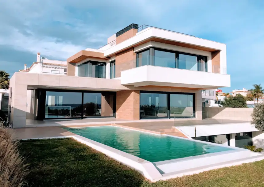 Contemporary villa with glass facade and garden