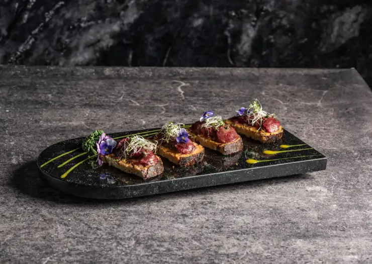 Plated appetiser with fresh herbs