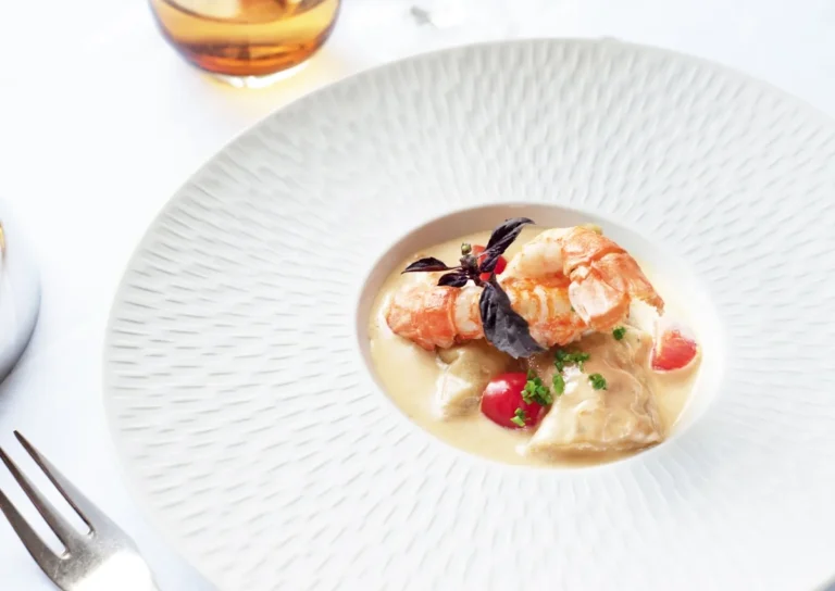 Roasted main dish served on a dark plate