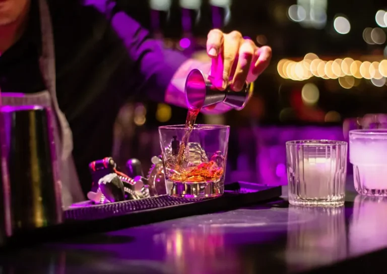 Craft cocktail garnished on a bar top