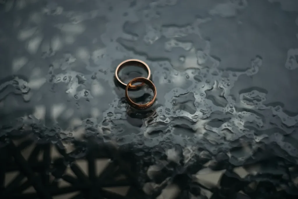 Wedding rings resting on a linen surface